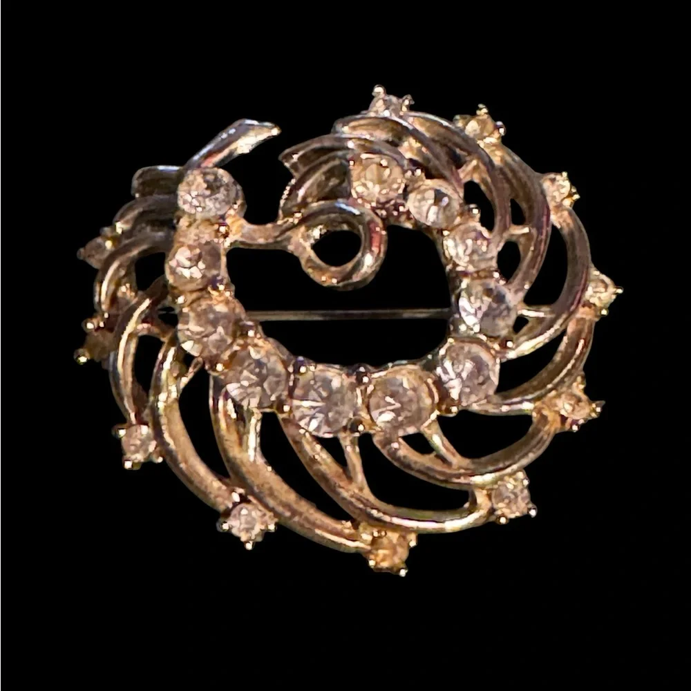Two crystal brooches